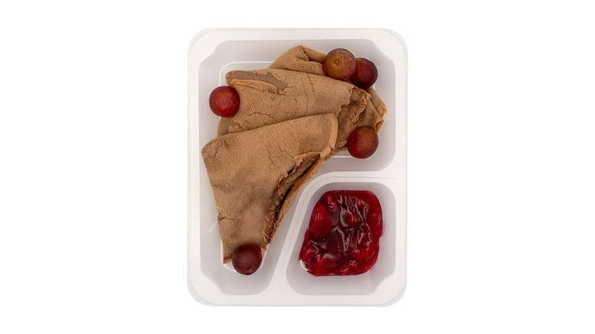 Chocolate crepes with banana quark, grapes, and strawberry jam
