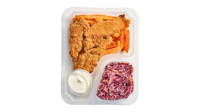 Chicken strips with garlic dip, sweet potato fries, and red cabbage coleslaw