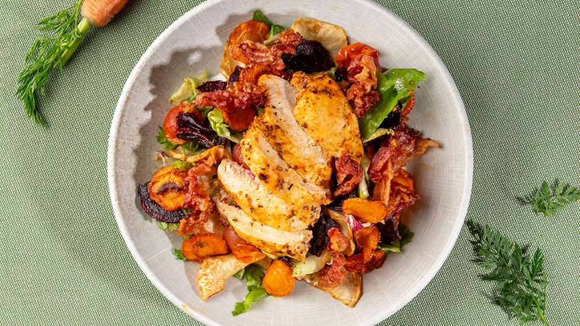 Fried root vegetable salad with crispy bacon and chicken