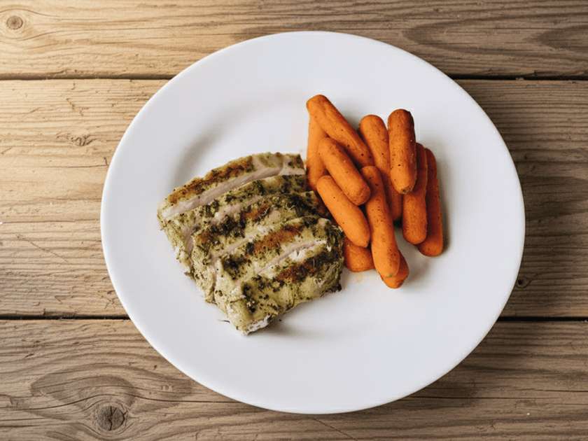 Grilled chicken fillet with baby carrots