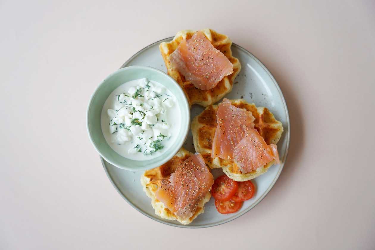 Cheese waffle bites with lightly salted salmon and green sauce