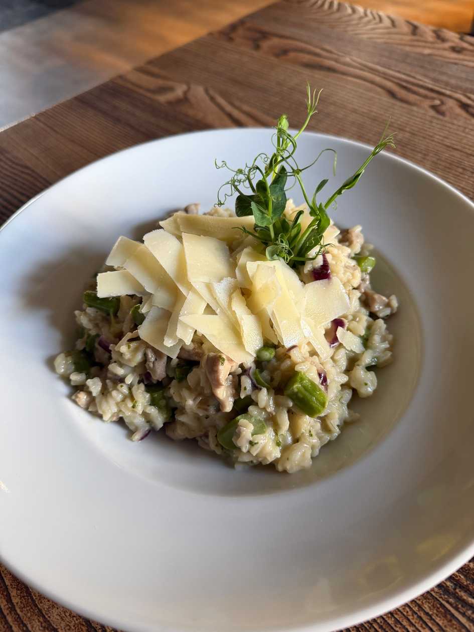 Risotto with fresh green asparagus and pork tenderloin, a splash of cream and herbs, Parmesan