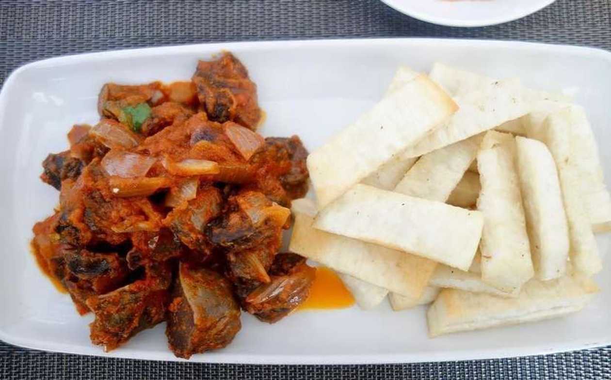 Fried yam with Fried gizzard served with eggs