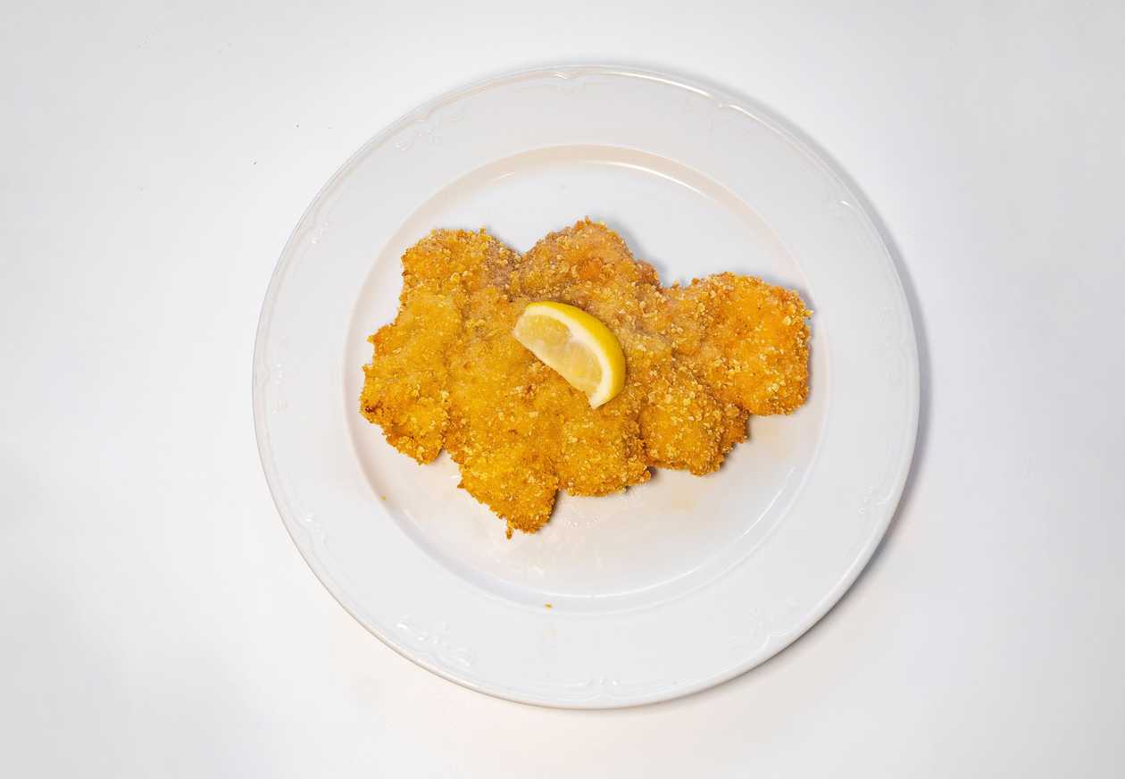 Fried pork neck wrapped in corn breadcrumbs, lemon