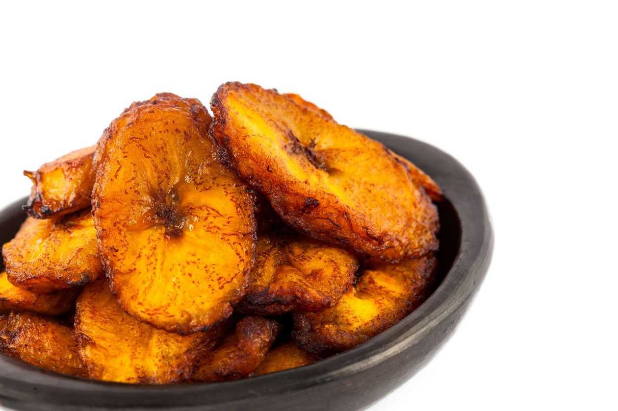 Fried plantain with Fried eggs fried gizzard served with chilli sauce ad veges