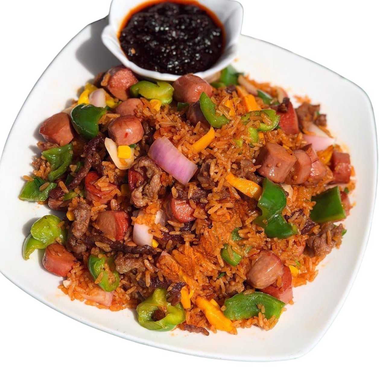 Jollof rice with vegetables and Fried chicken and Fried 2eggs