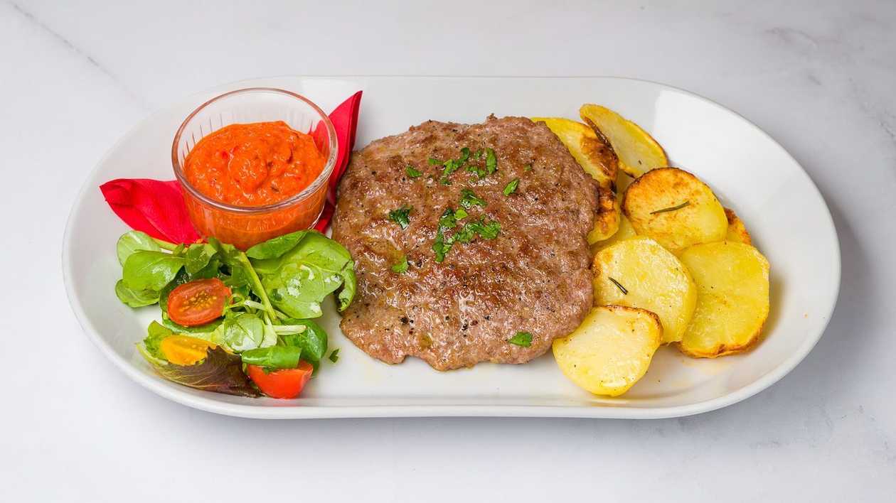 Grilled Traditional Balkan Meat with Roasted Potatoes and Ajvar Sauce