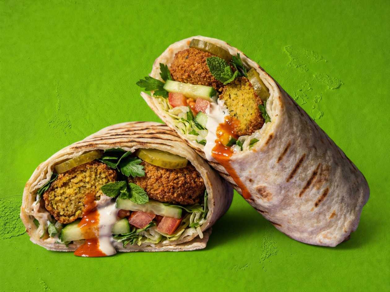 Falafel, cucumbers, french fries inside, vegetables, sauce