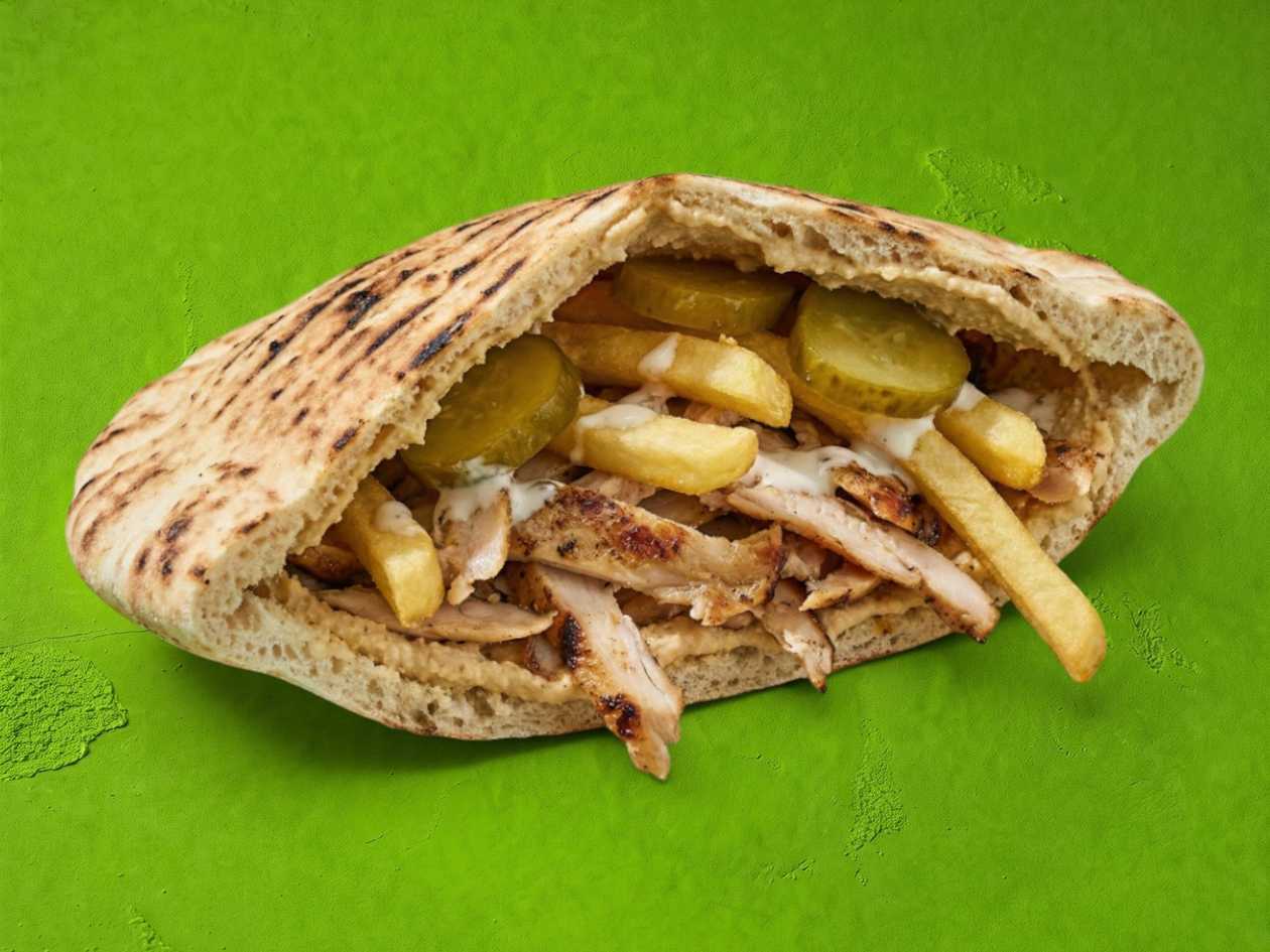 Grilled chicken (130), french fries inside, pickles, grilled pita, sauce