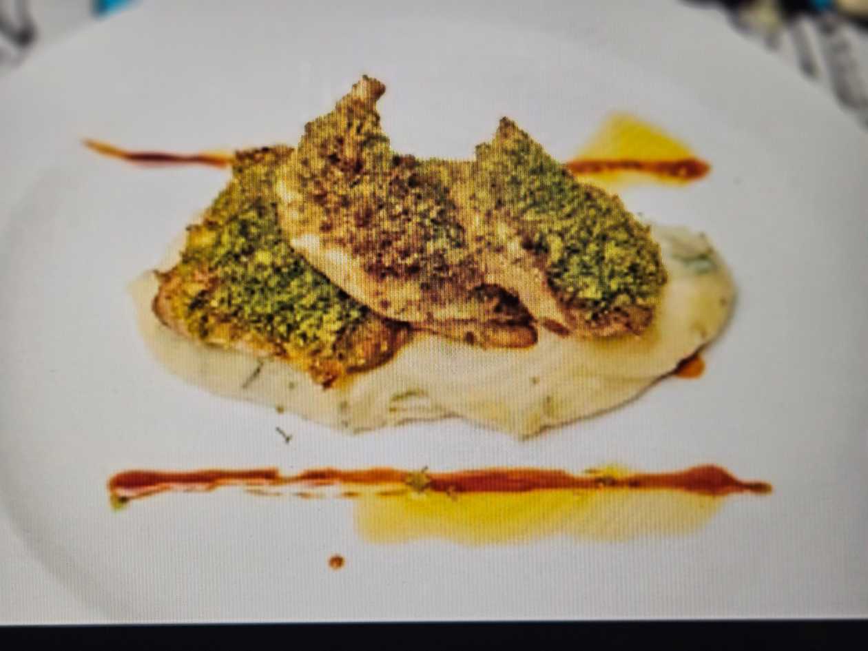 Herb crusted cockerel with mashed potatoes