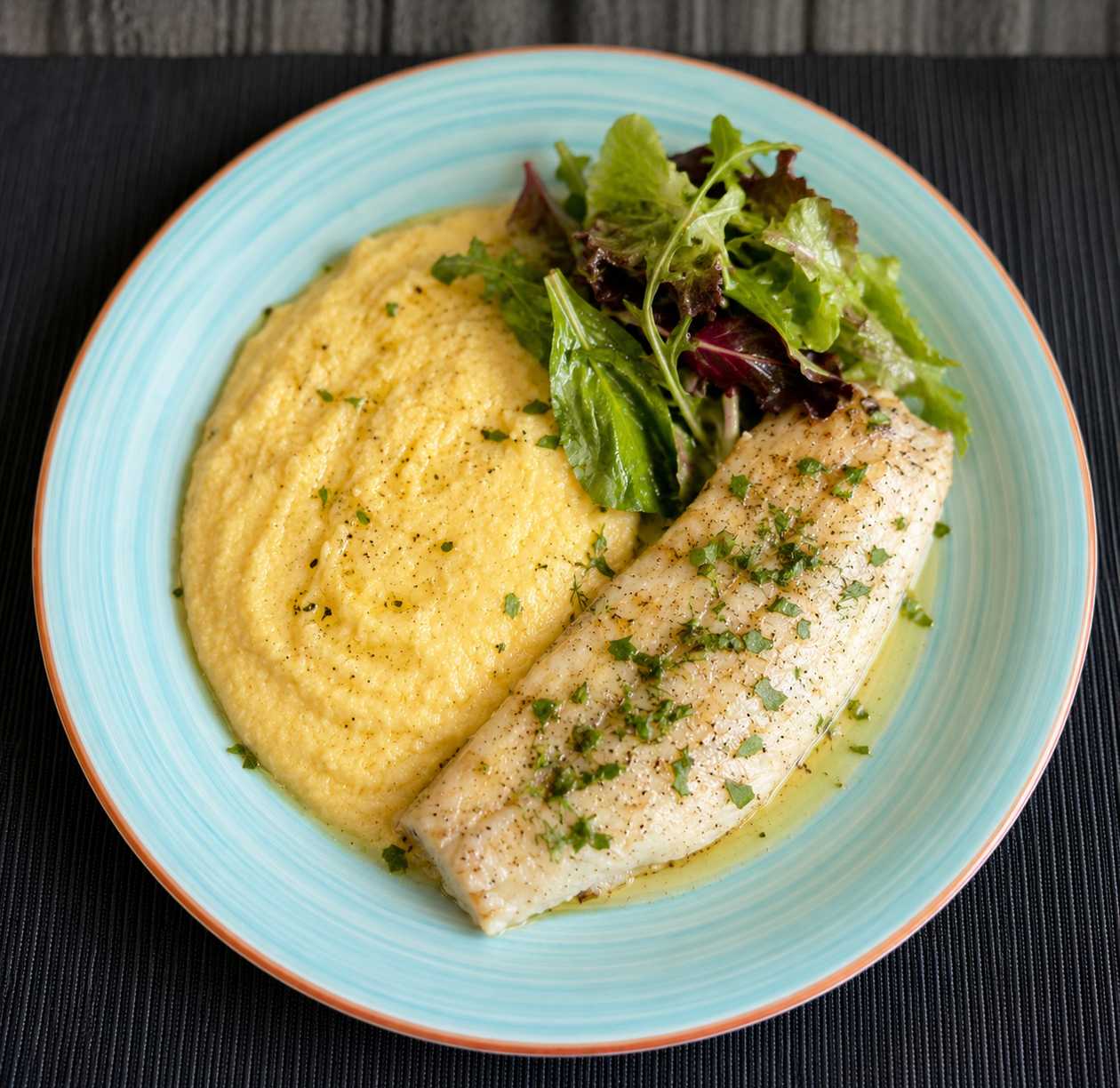 Baked Hake Fillet with Herb Butter, Potato-Celery Purée, and Leafy Salad