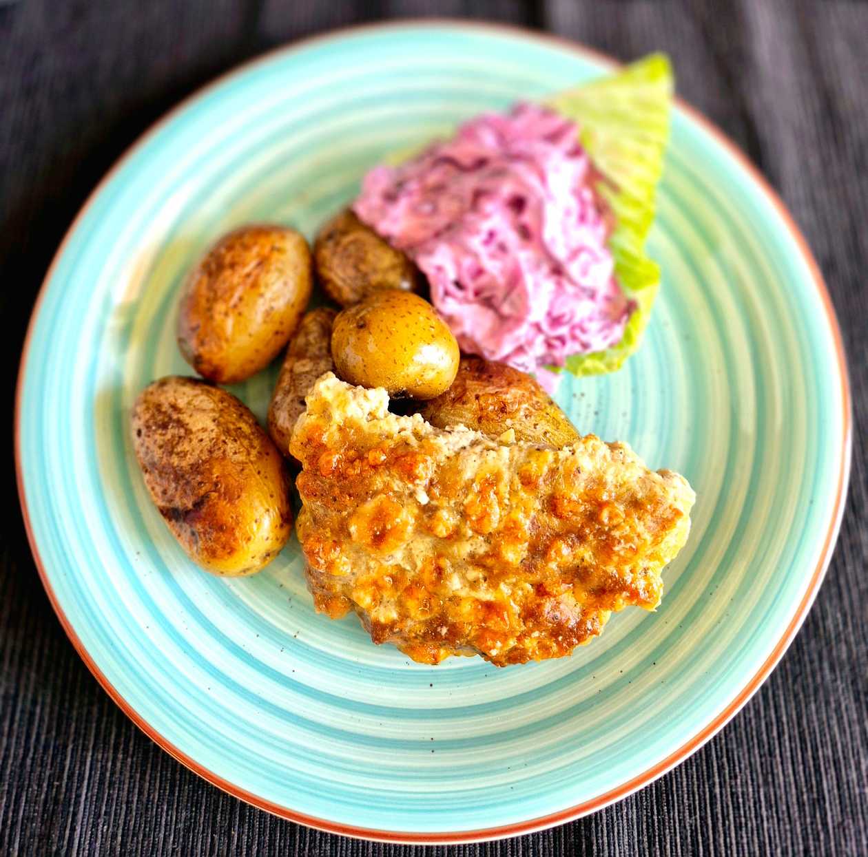 Ground Pork Schnitzel with Cheddar, Roasted Potatoes, and Red Coleslaw Salad