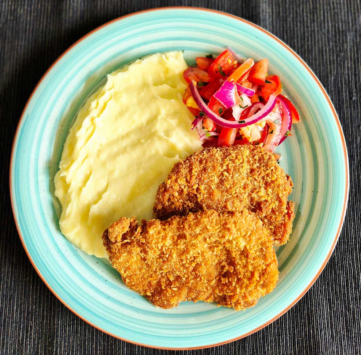 Pork Tenderloin Cutlets in Panko Breadcrumbs with Mashed Potatoes and Tomato Salad