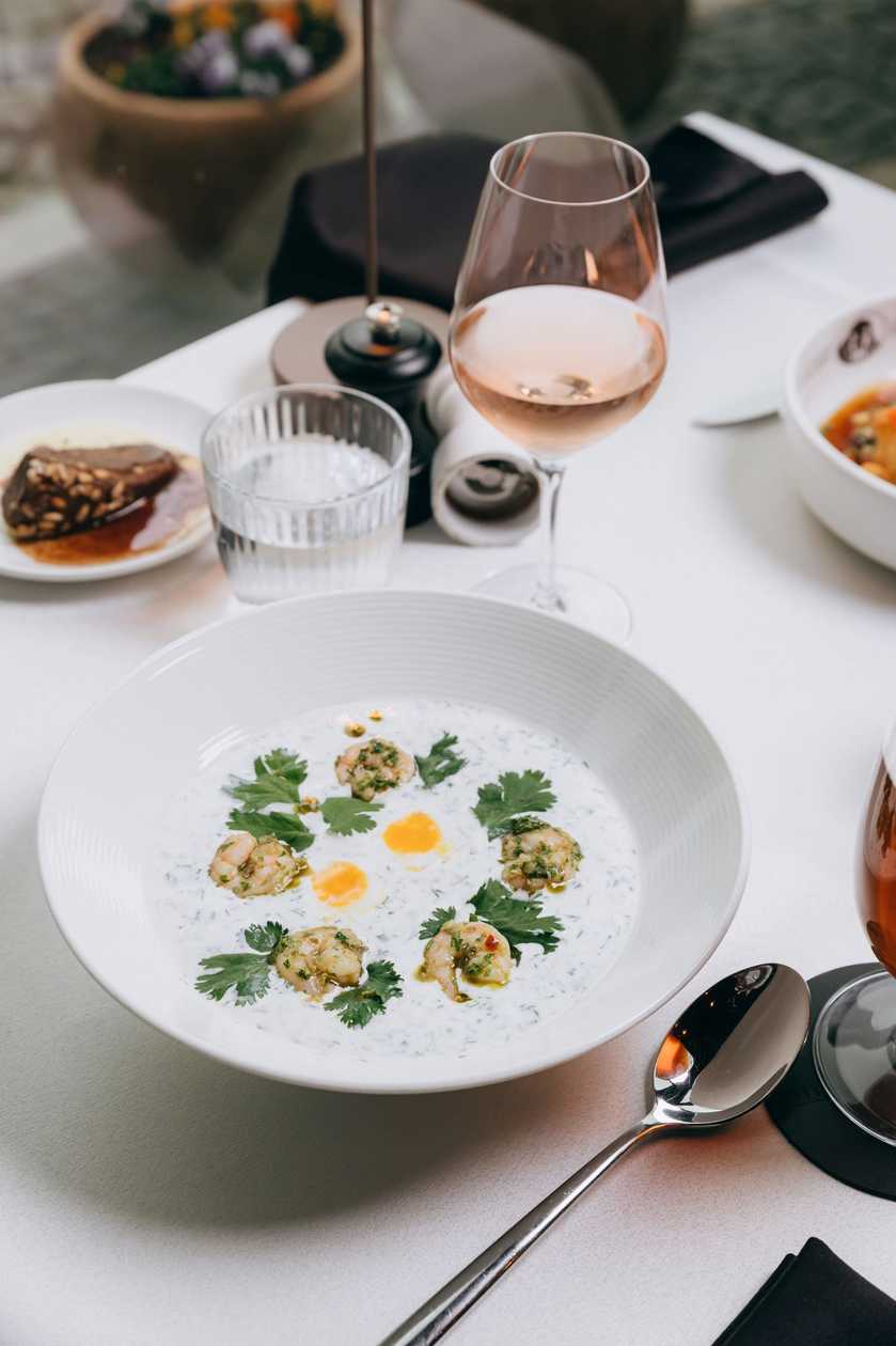 Cold white soup with tiger prawns
