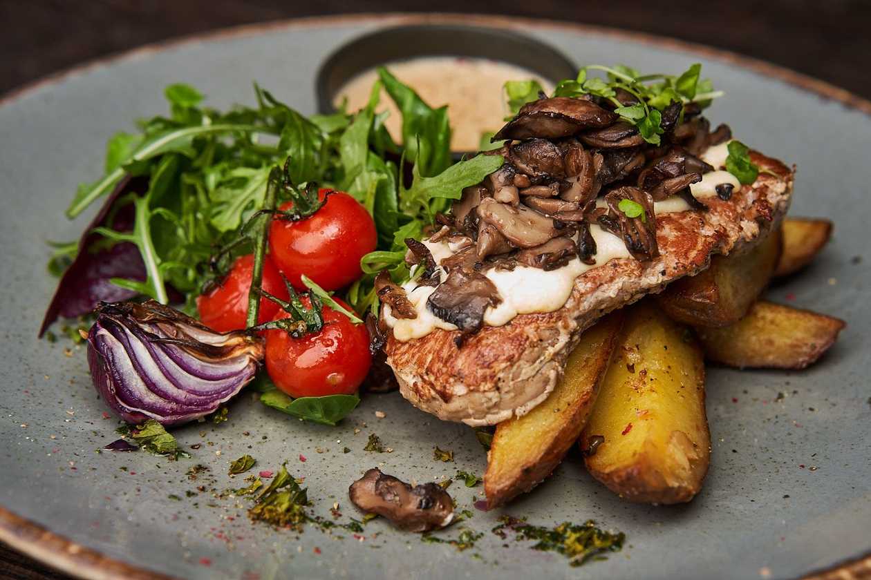 Pork tenderloin with mushrooms and cheese