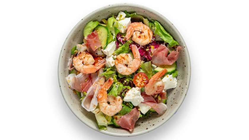 Salad with feta cheese, Serrano ham and shrimps