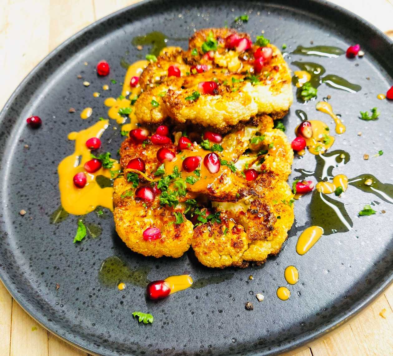 Cauliflower steak with nut-coconut sauce and chili crisp (V, L, G)