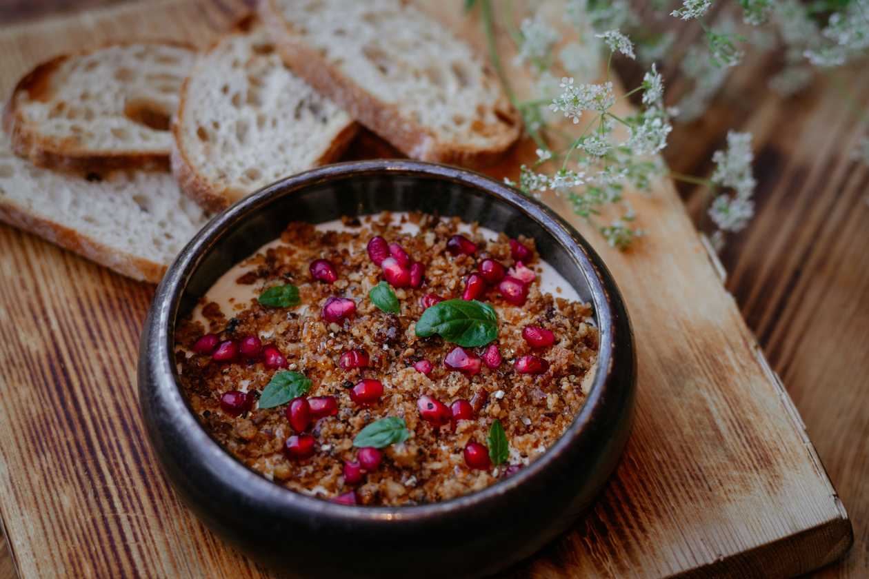 Brie cheese mousse with nut crisp and spicy honey