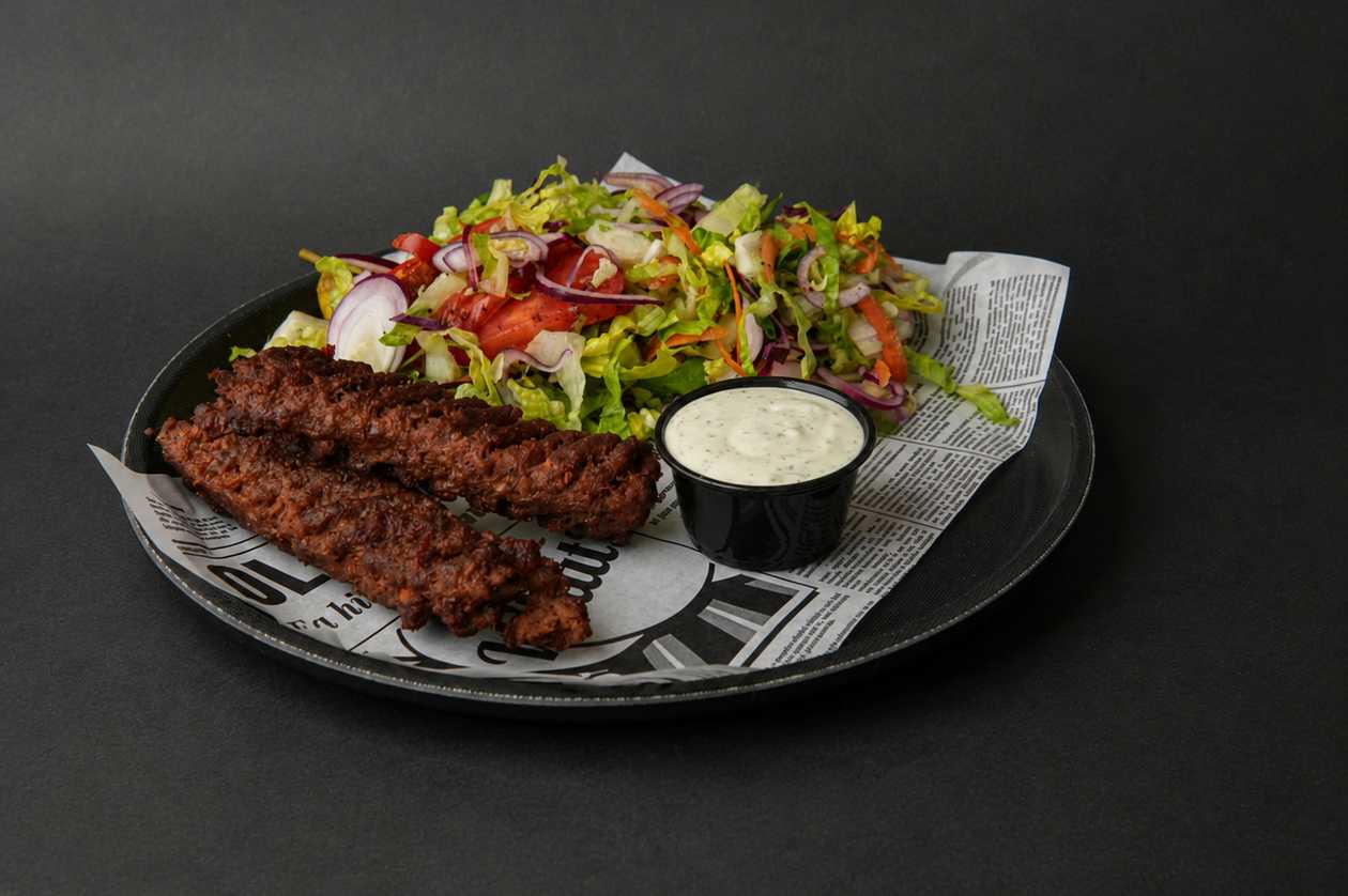 Salad with meat on plate