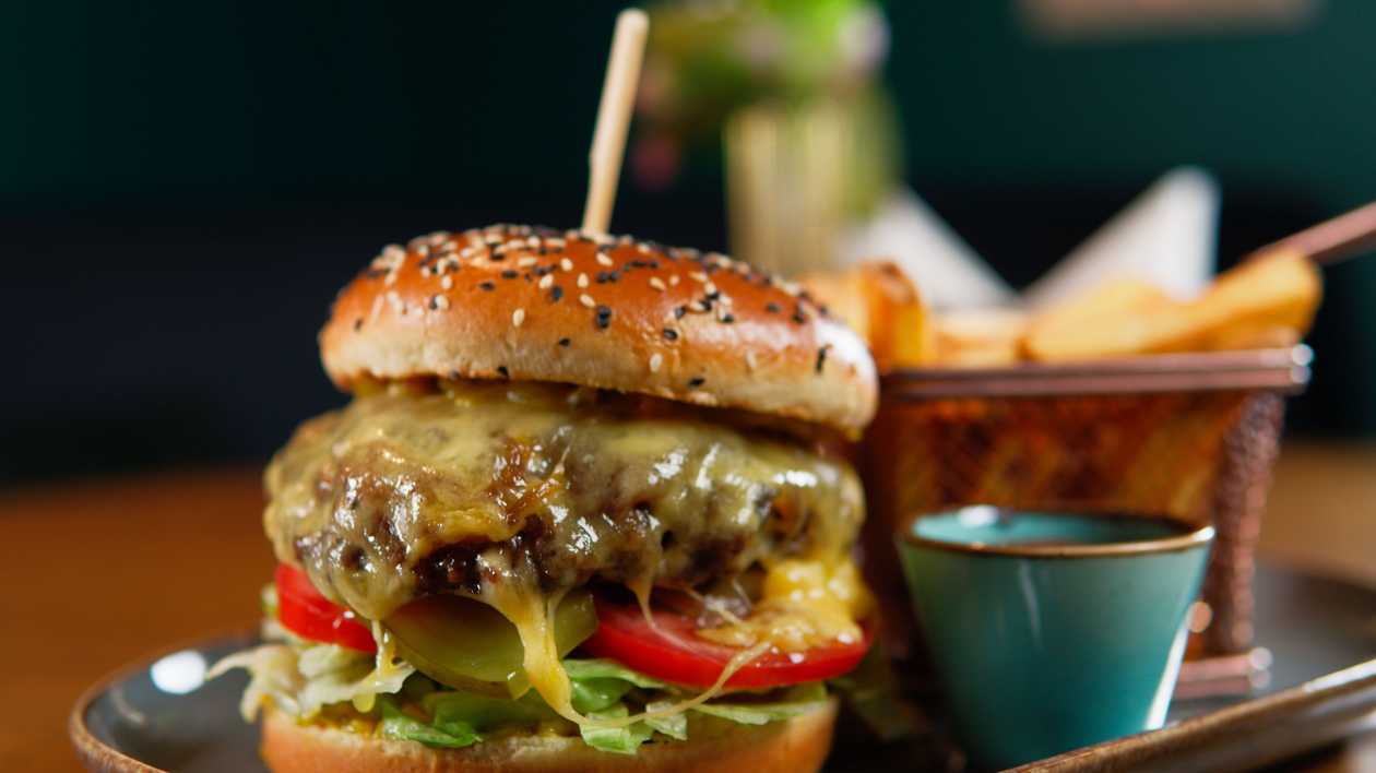 Beef burger with french fries and ketchup