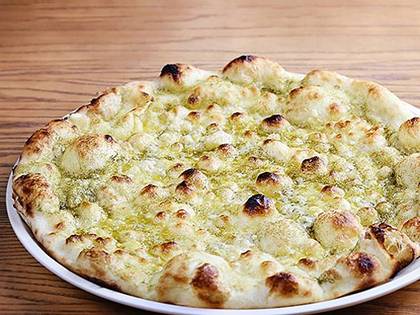 Focaccia with pesto sauce and Parmesan cheese