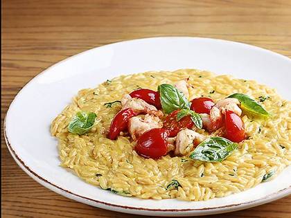 Orzo pasta with spicy shrimp, basil and cherry tomatoes