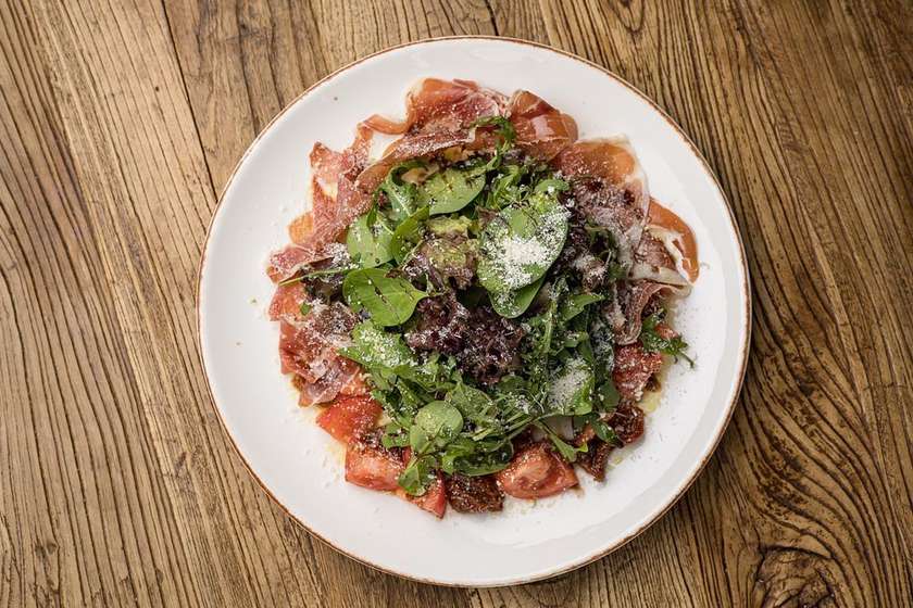 Salad with Prosciutto Crudo, tomatoes and greens