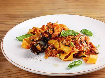 Pappardelle with seafood in tomato sauce