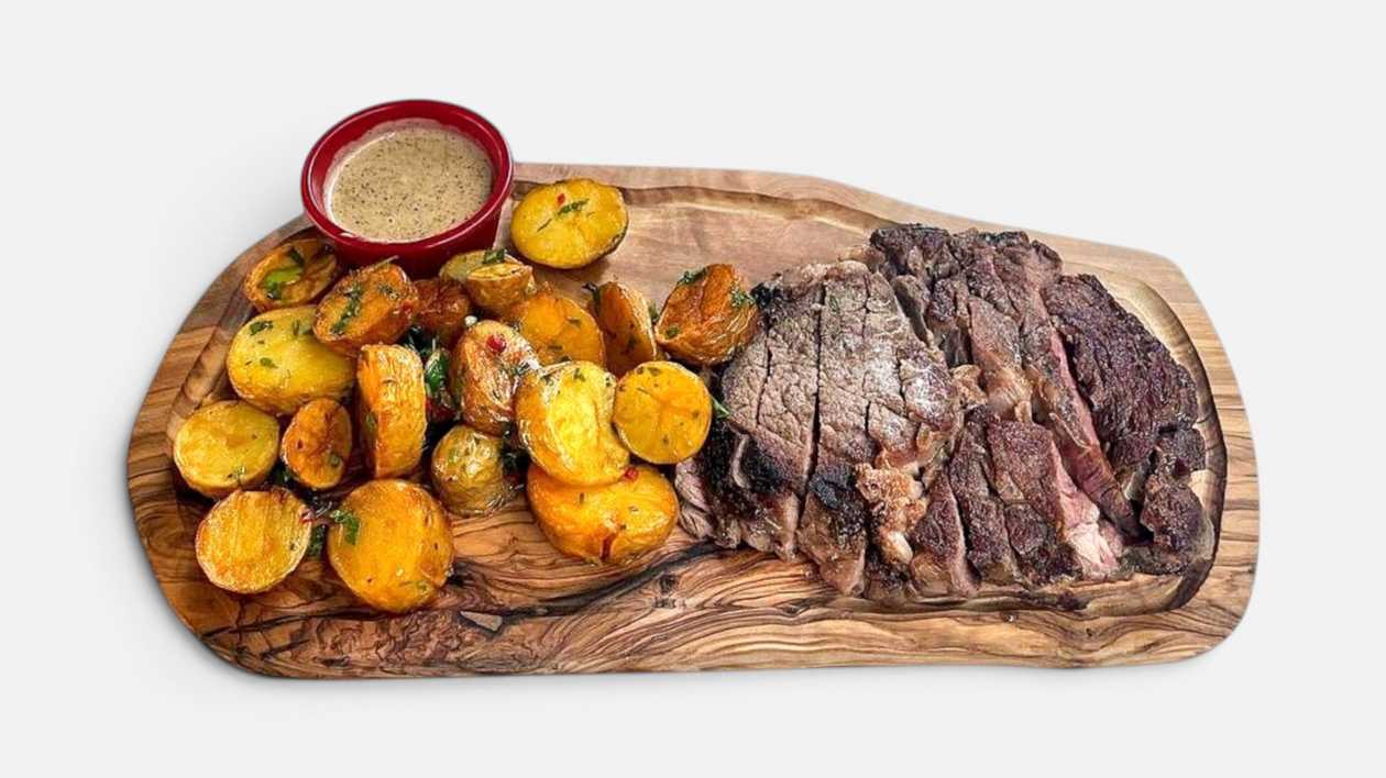 Ribeye Steak with baby Potatoes and Pepper Sauce