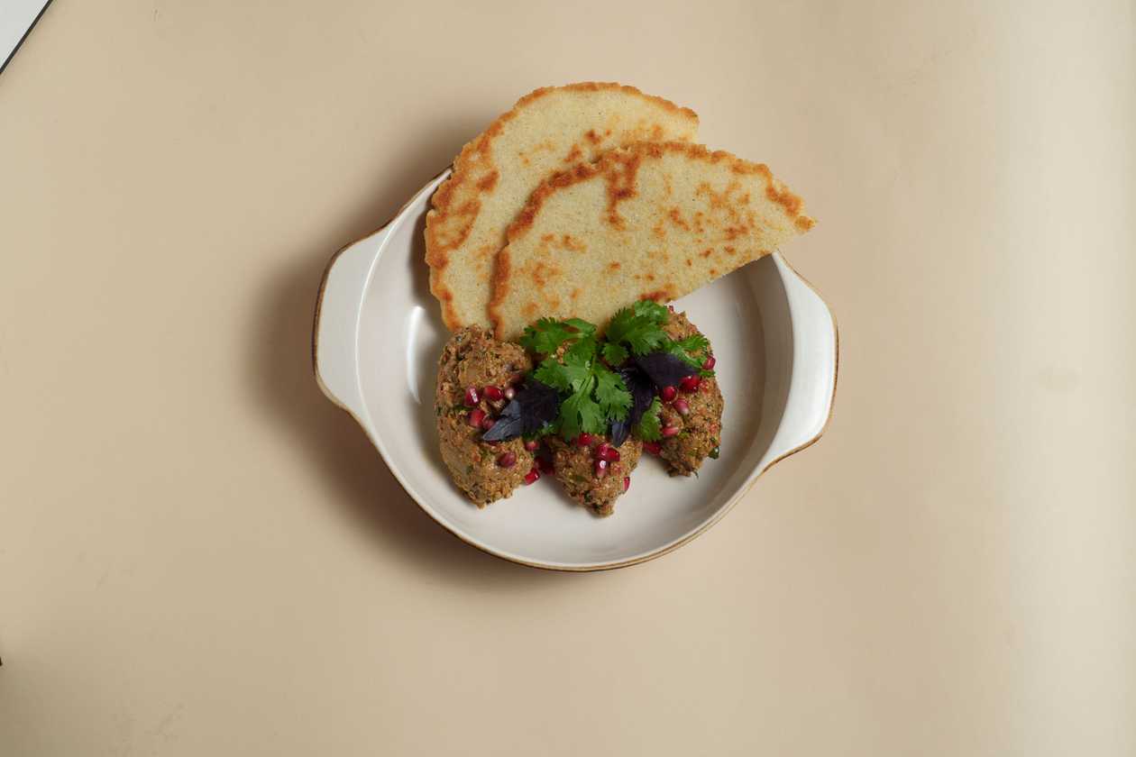 Fire-roasted eggplant with walnuts