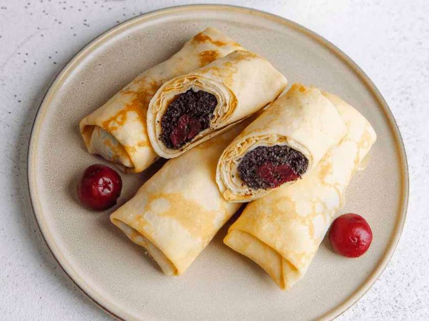 Pancakes with poppy seeds and cherries