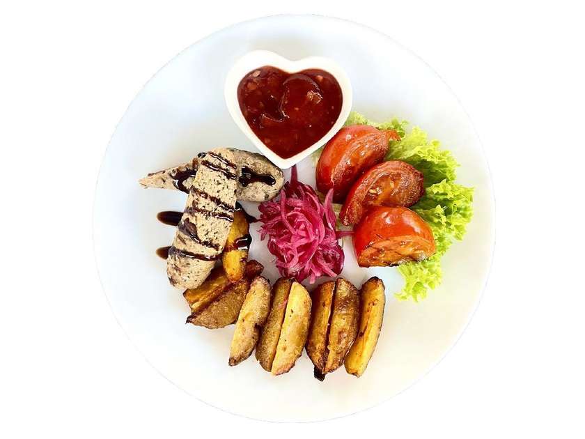 Veal Lyulya-kebab with potatoes, vegetables, and Satsabeli sauce