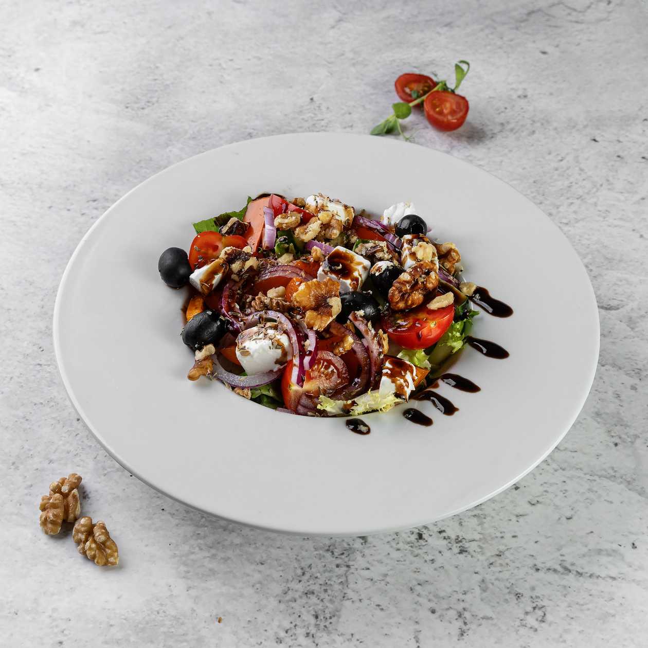 Greek salad with walnuts, fitaki cheese and olives