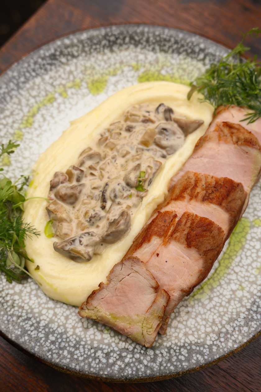 Pork tenderloin with potato pancakes and mushroom sauce