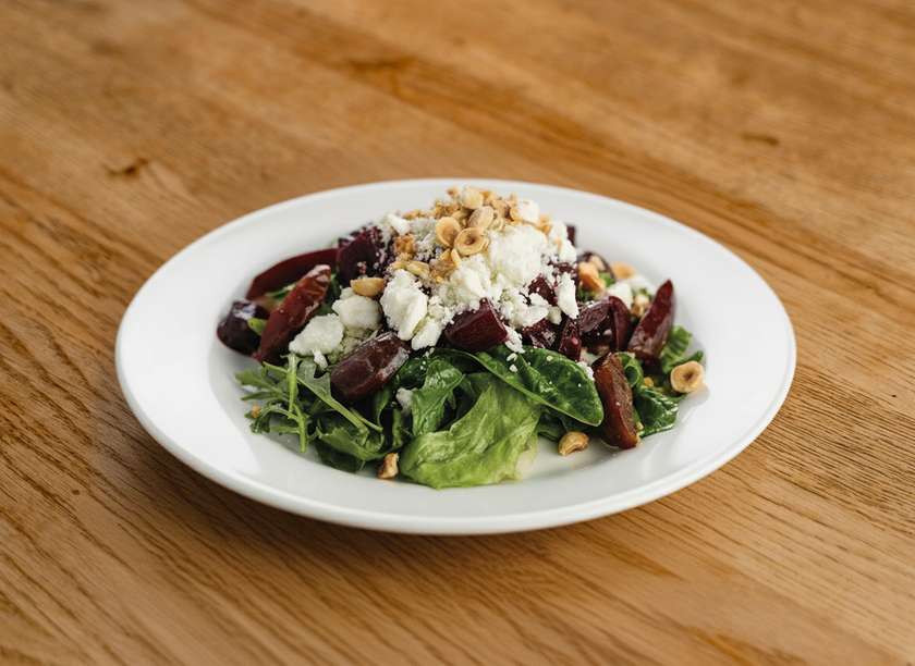 Salad with caramelized beets, young goat cheese and pickled plums