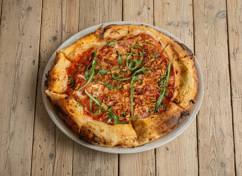 Spicy pizza with farm bacon
