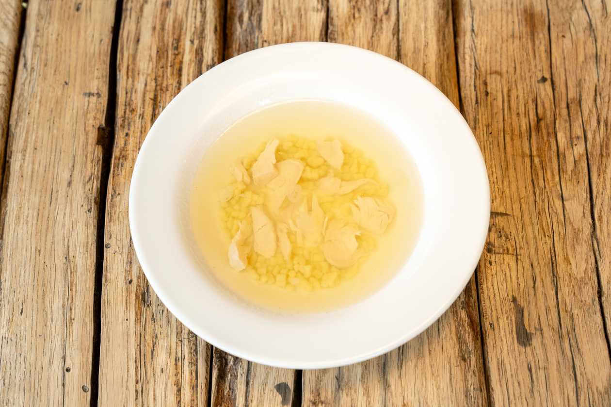 Chicken broth with mini ravioli