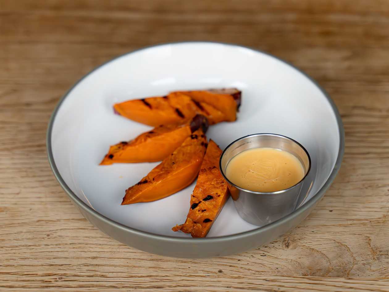 Roasted sweet potato with butter and cheese sauce