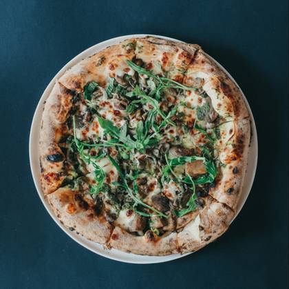 Pizza with chanterelles and porcini mushrooms