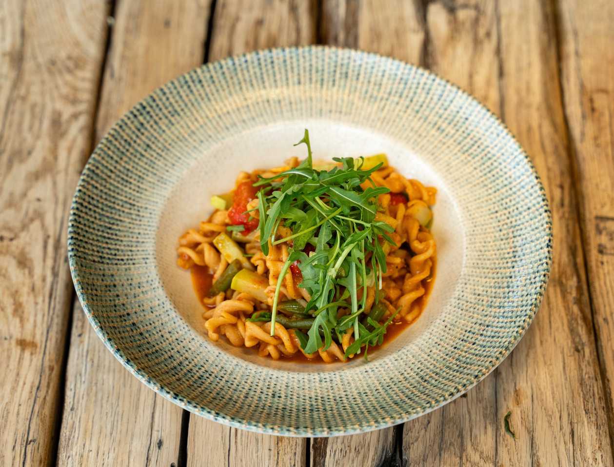 Pea fusilli with vegetables and cauliflower cream