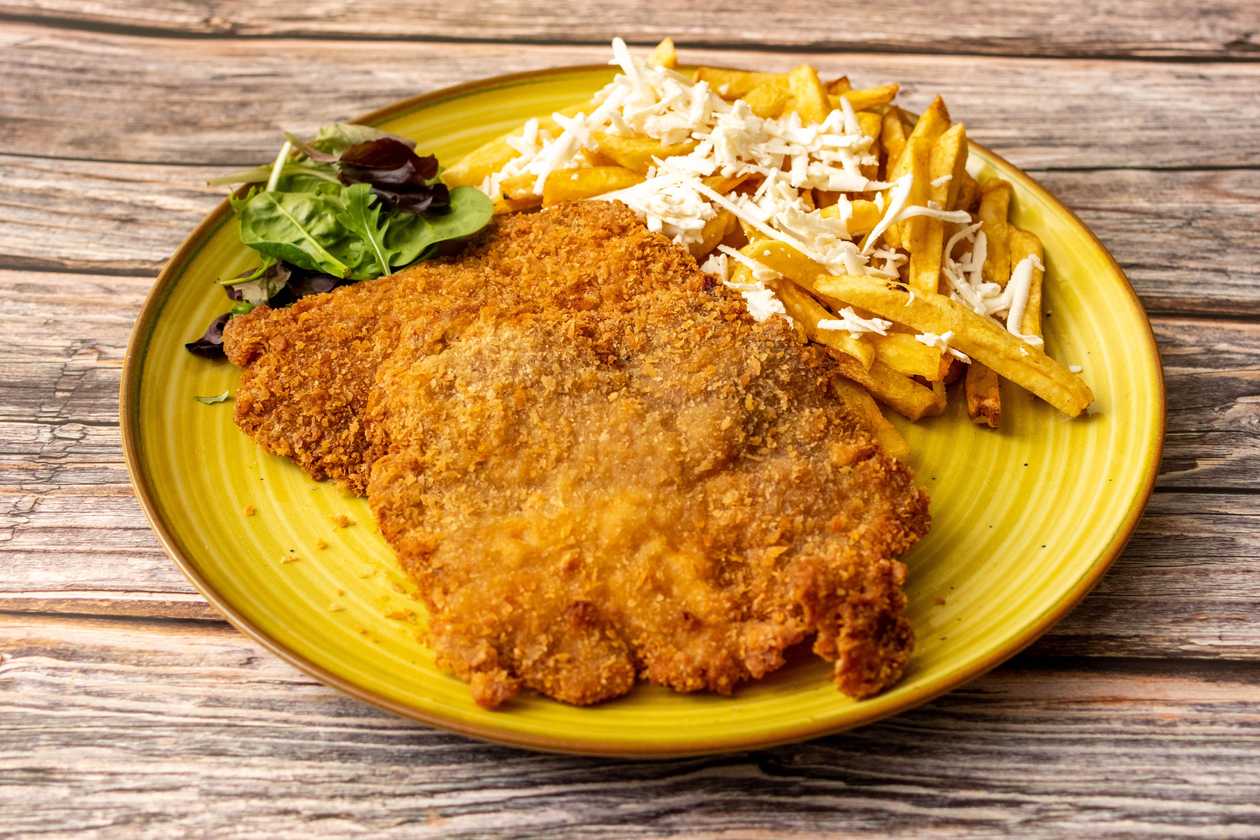 Pork Neck Schnitzel in Panko served with French Fries and Grated Cheese 500gr