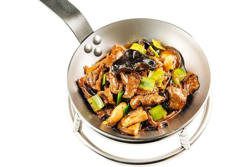 Veal with Wood Ear Mushrooms on a hot pan