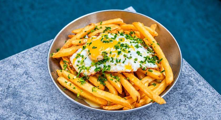 FRIES WITH BROWN BUTTER HOLLANDAISE SAUCE AND SUNNY SIDE UP EGG