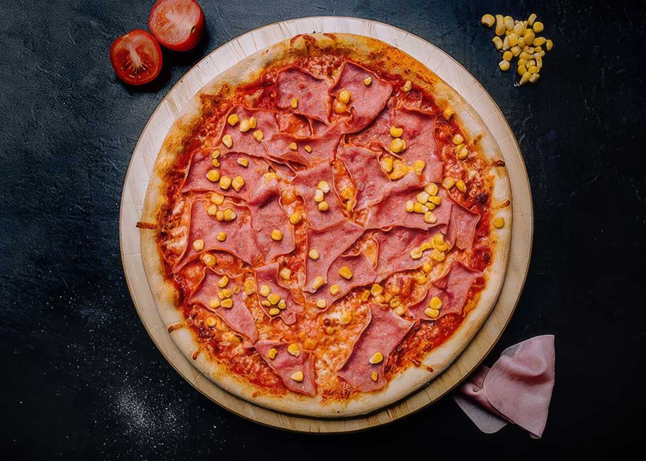 Gluten-free pizza with ham and corn