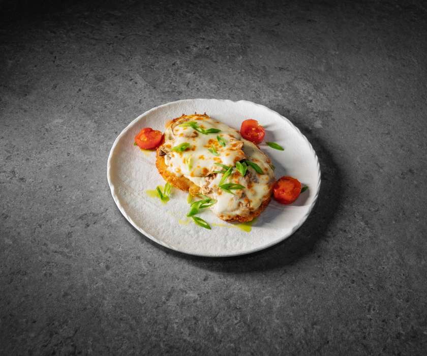 Chicken schnitzel baked with mushrooms
