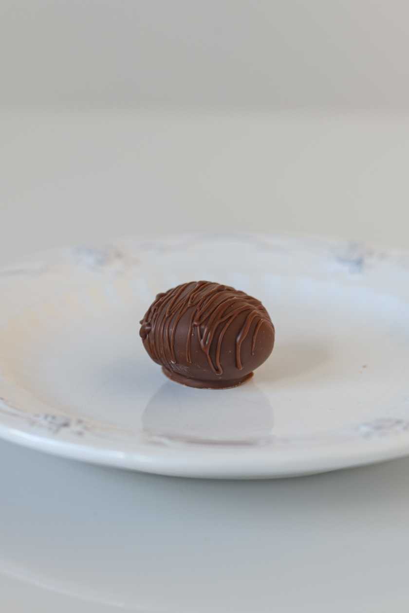 Raspberry flavored dark chocolate truffle. 1 pc.