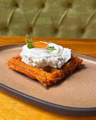 Sweet potato waffle with cream cheese and fried egg