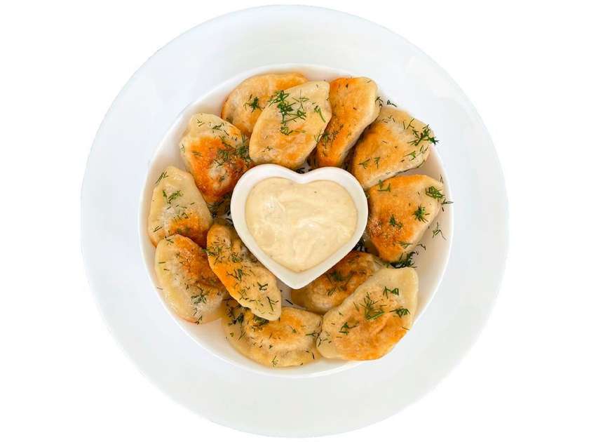 Fried Varenyky with potato and porcini mushrooms, served with Caesar sauce