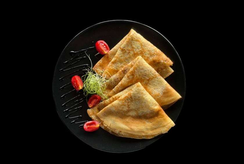 Crepes with chicken and mushrooms in a creamy sauce