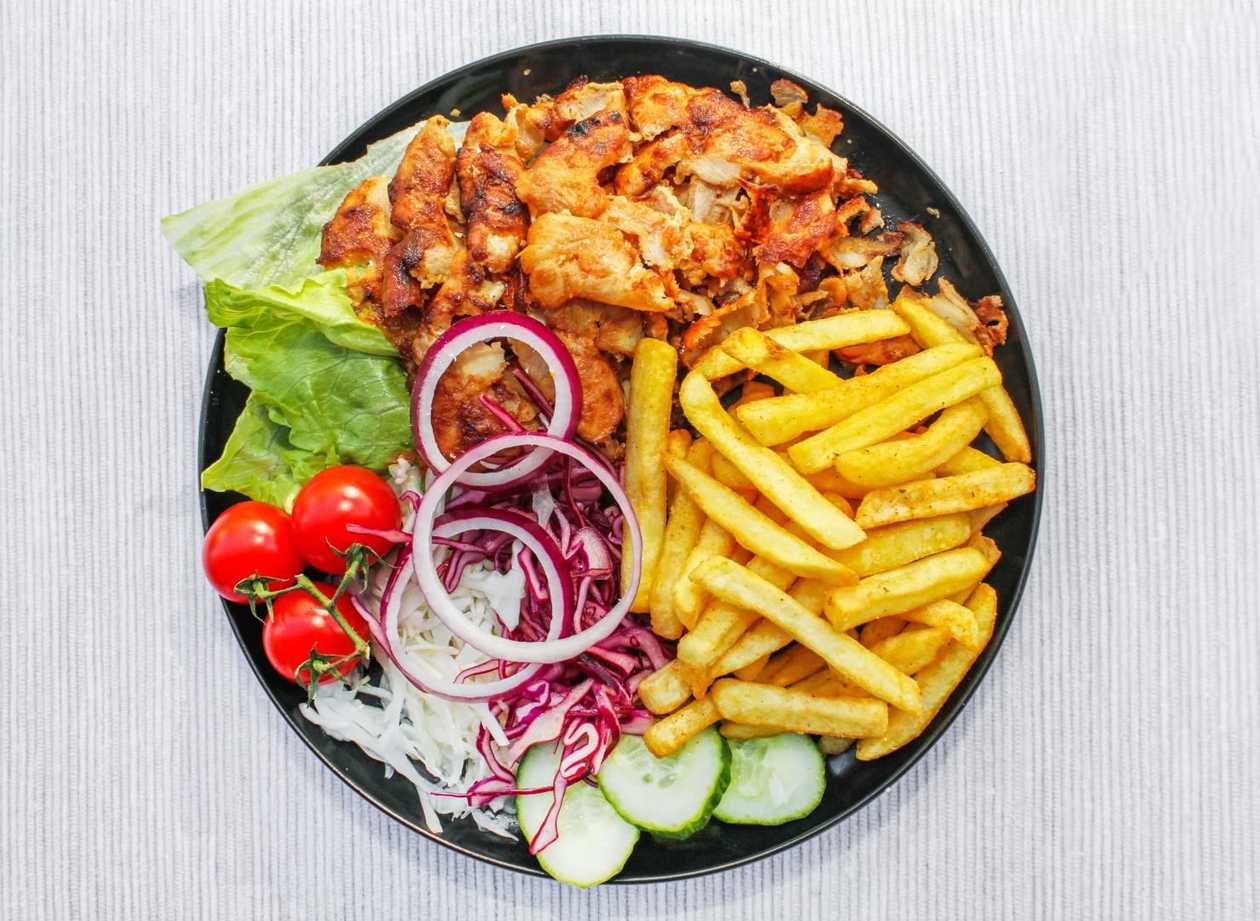 Plate of kebabs with chips
